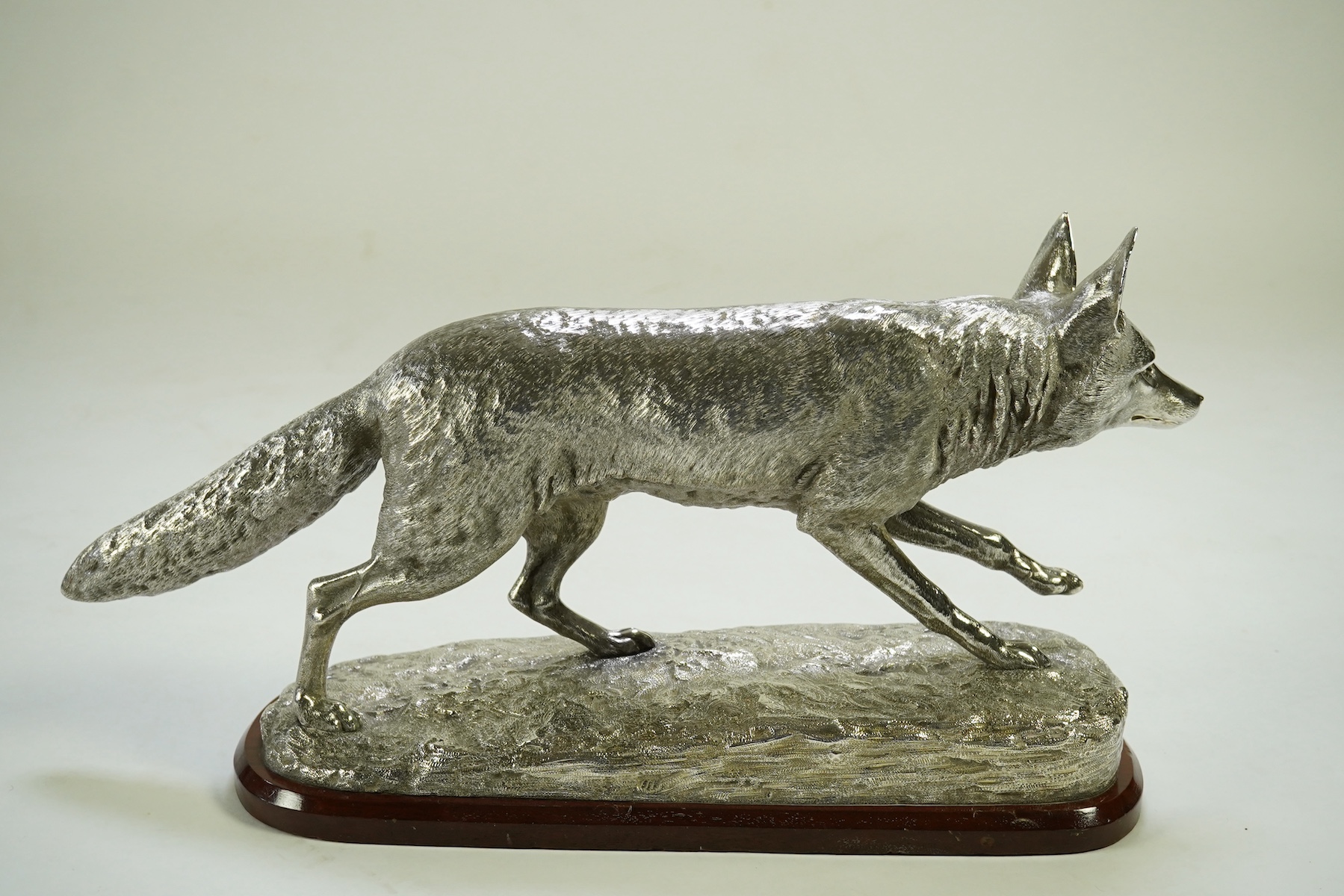 An impressive Victorian silver sculpture of a fox en passant, by R & S Garrard & Co (Robert Garrard II)